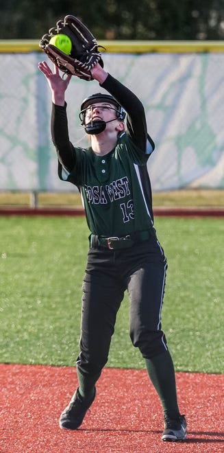Wauwatosa West second baseman Mikayla Timmers (13) pulls in a pop fly during the game at home against Wauwatosa East, Thursday, March 21, 2024.