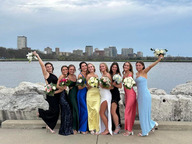 A group of Arrowhead High School students take prom photos along the shores of Lake Michigan in downtown Milwaukee on Saturday, April 27, 2024. The school's prom was held at the Brookfield Conference Center.